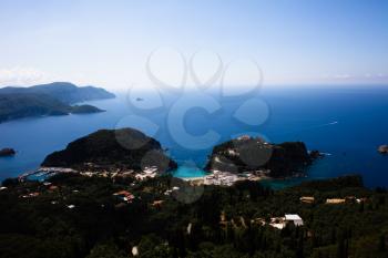Island aerial view blue ocean behind. Beautiful Greek landscape. Corfu Greece natural places. Mountain next to sea water. Gorgeous place. Traveling to other countries