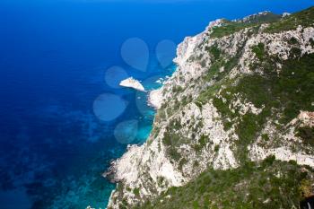 Rocky mountain coast bay aerial view. Beautiful landscape. Blue clear ocean sea water next to cliff Corfu Greece. Travel and adventure time. Vacations. Traveling abroad