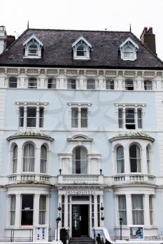 LLandudno, Wales, UK - MAY 27, 2018 Old hotel building with many windows. History buildings concept with old fashioned look. Closeup look of hotel building.