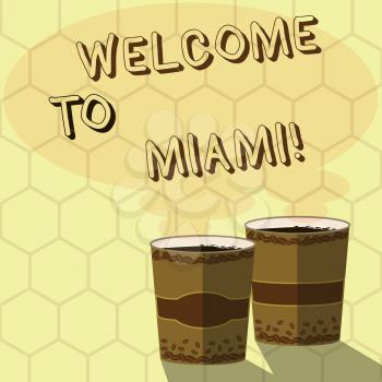 Handwriting text writing Welcome To Miami. Conceptual photo Arriving to Florida sunny city summer beach vacation Two To Go Cup with Beverage and Steam icon Blank Speech Bubble photo
