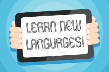 Text sign showing Learn New Languages. Business photo showcasing developing ability to communicate in foreign lang Color Tablet Smartphone with Blank Screen Handheld from the Back of Gadget