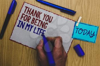 Conceptual hand writing showing Thank You For Being In My Life. Business photo text loving someone for being by your side Man holding marker paper clothespin express ideas wooden table