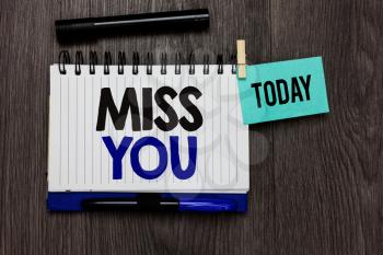 Conceptual hand writing showing Miss You. Business photo text Longing for an important person in your life for a period of time Ideas notebook wooden table markers for today important reminder