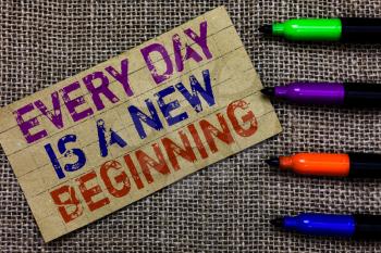 Handwriting text writing Every Day Is A New Beginning. Concept meaning you have a chance to dream work live better Paperboard computer mouse jute background Expressing ideas typing needs