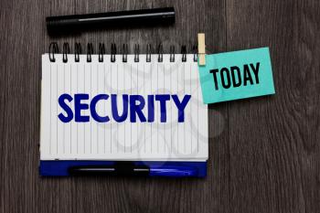 Conceptual hand writing showing Security. Business photo text The state of feeling safe stable and free from fear or danger Ideas notebook wooden table markers for today important reminder