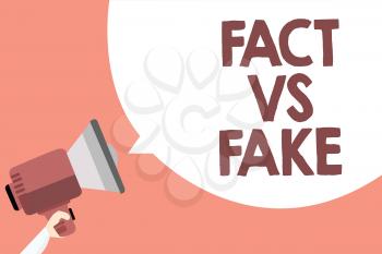 Handwriting text Fact Vs Fake. Concept meaning Rivalry or products or information originaly made or imitation Megaphone loudspeaker loud screaming scream idea talk talking speech bubble