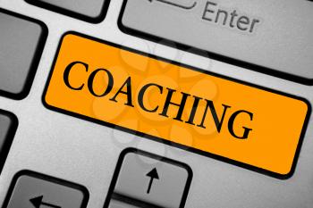 Text sign showing Coaching. Conceptual photo person supports client in achieving specific personal goal Keyboard orange key Intention create computer computing reflection document