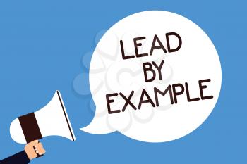 Writing note showing Lead By Example. Business photo showcasing Be a mentor leader follow the rules give examples Coach Man hold megaphone loudspeaker speech bubble screaming blue background