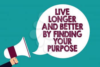 Text sign showing Live Longer And Better By Finding Your Purpose. Conceptual photo Look for a goal set mission Man holding megaphone loudspeaker speech bubble screaming green background