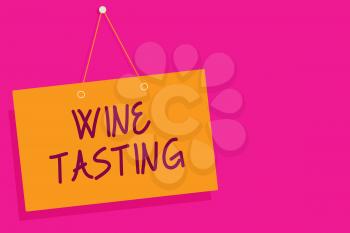 Word writing text Wine Tasting. Business concept for Degustation Alcohol Social gathering Gourmet Winery Drinking Orange board wall message communication open close sign pink background