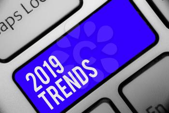 Writing note showing 2019 Trends. Business photo showcasing things that is famous for short period of time in current year Keyboard blue key Intention computer computing reflection document
