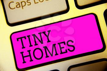 Text sign showing Tiny Homes. Conceptual photo houses contain one room only or two and small entrance Cheap Keyboard purple key Intention create computer computing reflection document