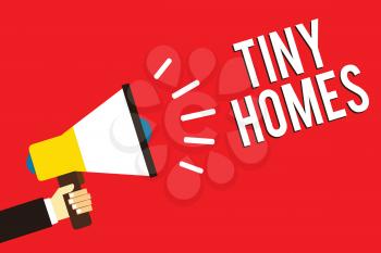 Word writing text Tiny Homes. Business concept for houses contain one room only or two and small entrance Cheap Man holding megaphone loudspeaker red background message speaking loud