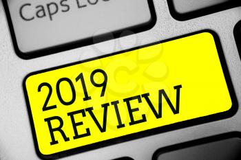 Text sign showing 2019 Review. Conceptual photo seeing important events or actions that made previous year Keyboard yellow key Intention create computer computing reflection document