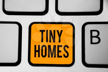 Text sign showing Tiny Homes. Conceptual photo houses contain one room only or two and small entrance Cheap Keyboard orange key Intention create computer computing reflection document