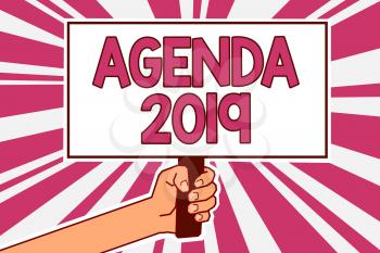 Word writing text Agenda 2019. Business concept for list of activities in order which they are to be taken up Man hand holding poster important protest message pink rays background