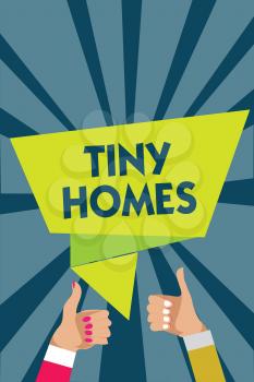 Handwriting text writing Tiny Homes. Concept meaning houses contain one room only or two and small entrance Cheap Man woman hands thumbs up approval speech bubble origami rays background