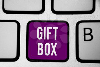 Writing note showing Gift Box. Business photo showcasing A small cointainer with designs capable of handling presents Keyboard purple key Intention computer computing reflection document