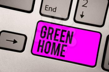 Text sign showing Green Home. Conceptual photo An area filled with plants and trees where you can relax Keyboard purple key Intention create computer computing reflection document