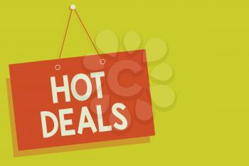 Handwriting text Hot Deals. Concept meaning An agreement through which one of the paties is offered and accept Red board wall message communication open close sign yellow background