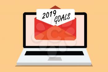 Handwriting text 2019 Goals. Concept meaning A plan to do for something new and better for the coming year Computer receiving email important message envelope with paper virtual