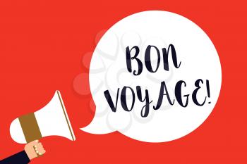 Handwriting text Bon Voyage. Concept meaning used express good wishes to someone about set off on journey Man holding megaphone loudspeaker speech bubble screaming red background