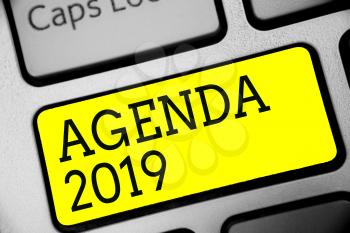 Text sign showing Agenda 2019. Conceptual photo list of activities in order which they are to be taken up Keyboard yellow key Intention create computer computing reflection document