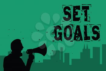 Word writing text Set Goals. Business concept for Defining or achieving something in the future based on plan Man holding megaphone speaking politician making promises green background