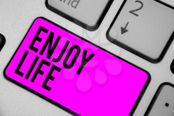 Text sign showing Enjoy Life. Conceptual photo Any thing, place,food or person, that makes you relax and happy Keyboard purple key Intention create computer computing reflection document