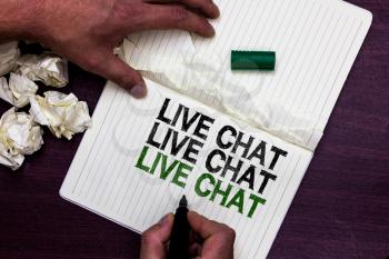 Text sign showing Live Chat Live Chat Live Chat. Conceptual photo talking with people friends relatives online Man holding marker notebook page crumpled papers several tries mistakes