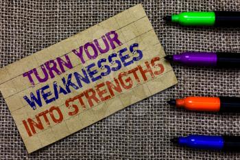 Handwriting text writing Turn Your Weaknesses Into Strengths. Concept meaning work on your defects to get raid of them Paperboard computer mouse jute background Expressing ideas typing needs