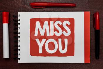 Text sign showing Miss You. Conceptual photo Longing for an important person in your life for a period of time Important ideas highlighted notebook markers wooden table reminder message