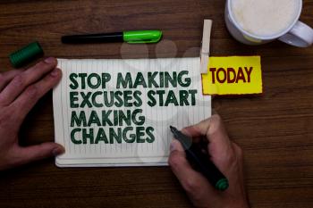 Word writing text Stop Making Excuses Start Making Changes. Business concept for Do not give an excuse Act instead Man holding marker notebook clothespin reminder wooden table cup coffee