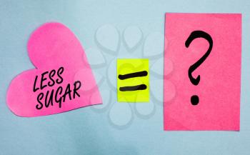 Text sign showing Less Sugar. Conceptual photo Lower volume of sweetness in any food or drink that we eat Pink paper notes heart equal sign question mark important answer romantic