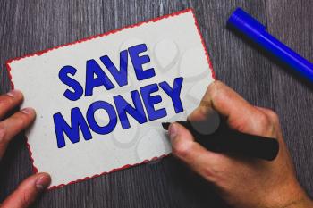 Writing note showing Save Money. Business photo showcasing store some of your cash every month to use them sometime later Man holding marker paper red borders express ideas Wooden background