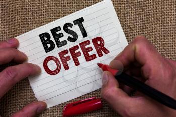 Writing note showing Best Offer. Business photo showcasing To convince someone by rendering all the greatness you can give Man's hand hold white paper with symbolic letter jute sack background