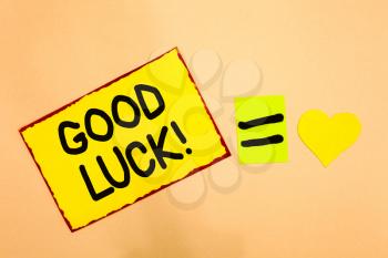 Conceptual hand writing showing Good Luck. Business photo text A positive fortune or a happy outcome that a person can have Yellow paper reminder equal sign heart sending romantic feelings