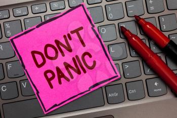 Text sign showing Don t not Panic. Conceptual photo sudden strong feeling of fear prevents reasonable thought Pink paper keyboard Inspiration communicate ideas messages Red markers