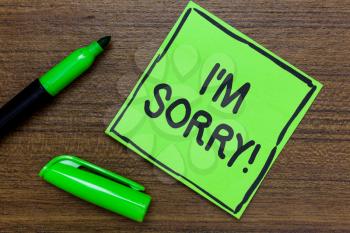 Conceptual hand writing showing I am Sorry. Business photo showcasing To ask for forgiveness to someone you unintensionaly hurt Green Paper Communicate ideas Marker Wooden background