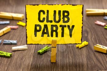 Text sign showing Club Party. Conceptual photo social gathering in a place that is informal and can have drinks Clothespin holding yellow paper note several clothespins wooden floor