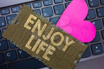 Conceptual hand writing showing Enjoy Life. Business photo text Any thing, place,food or person, that makes you relax and happy Paperboard Romantic lovely message Heart Keyboard Type computer