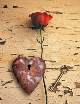 Surrealism. Red rose and rusted heart with keyhole. Golden key.