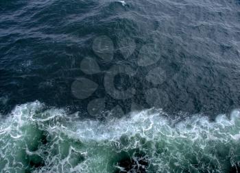Aerial view. Ocean waves and foam on water surface