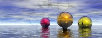 Colorful spheres hovers above ocean