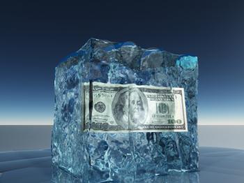 One hundred dollar bill frozen in ice cube