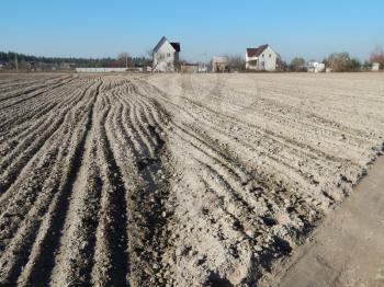Tractor plowed field and arable land