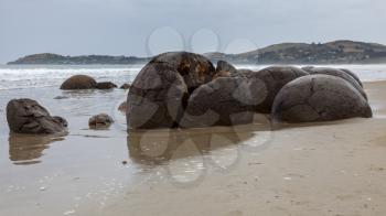 Moeraki Boulders at Koekohe Beach on the wave-cut Otago coast of New Zealand