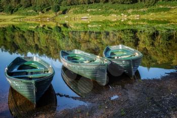 Rowing Boats Moored at Watendlath Tarn in the Lake District Cumbria