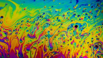 Extreme close-up of the colourful surface of a bubble