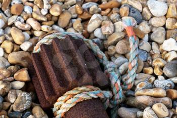 Nylon rope and old winch gear laying on the beach at Dungeness